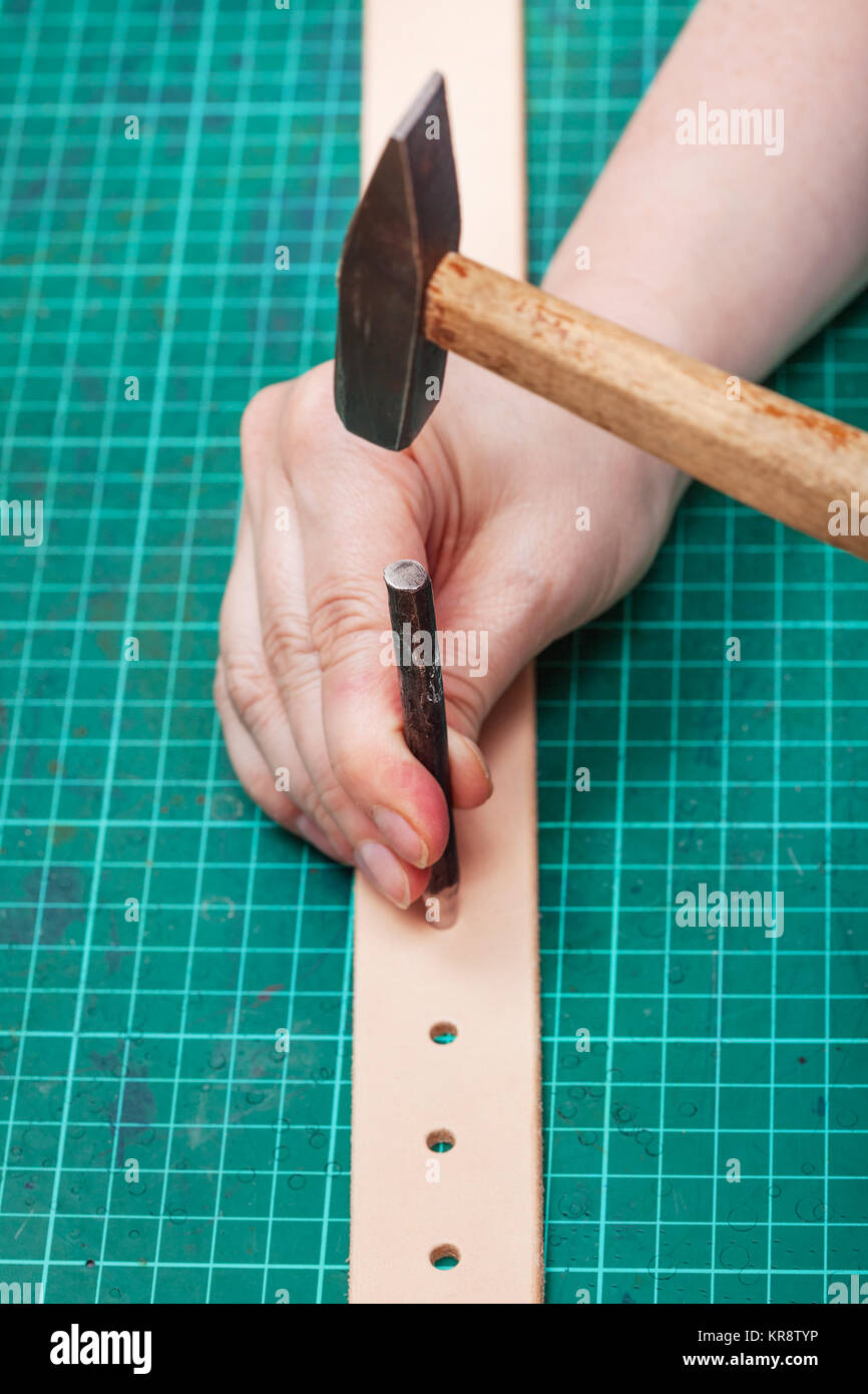 making a hole in a belt
