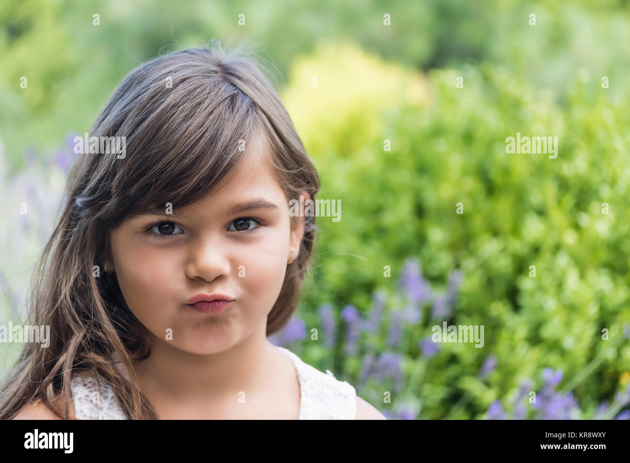 Little girl with pursed lips Stock Photo Alamy