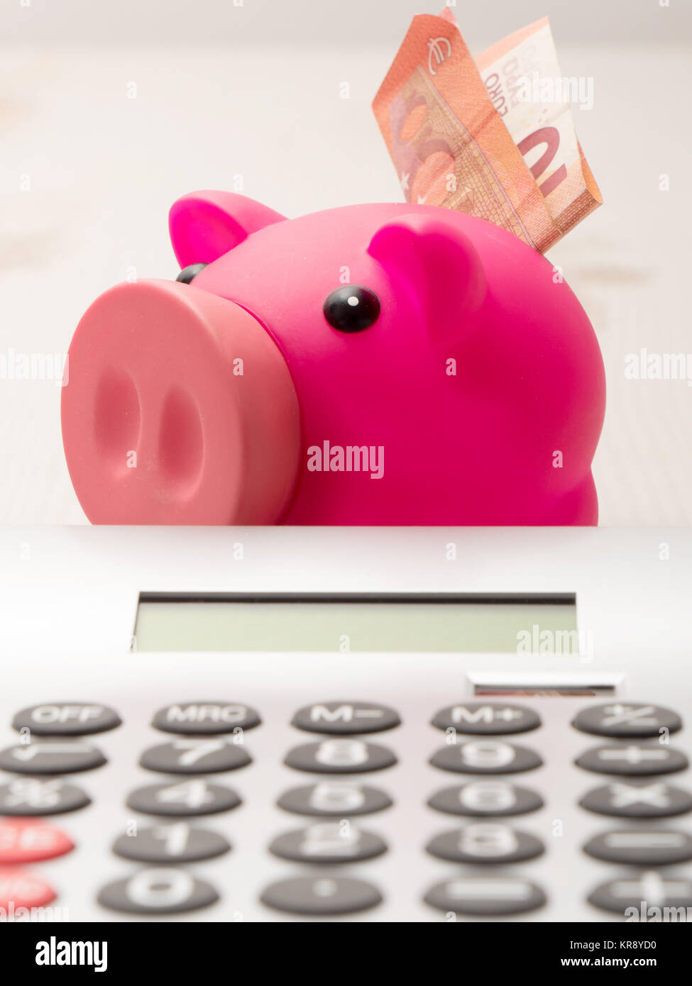 piggy bank and calculator Stock Photo - Alamy