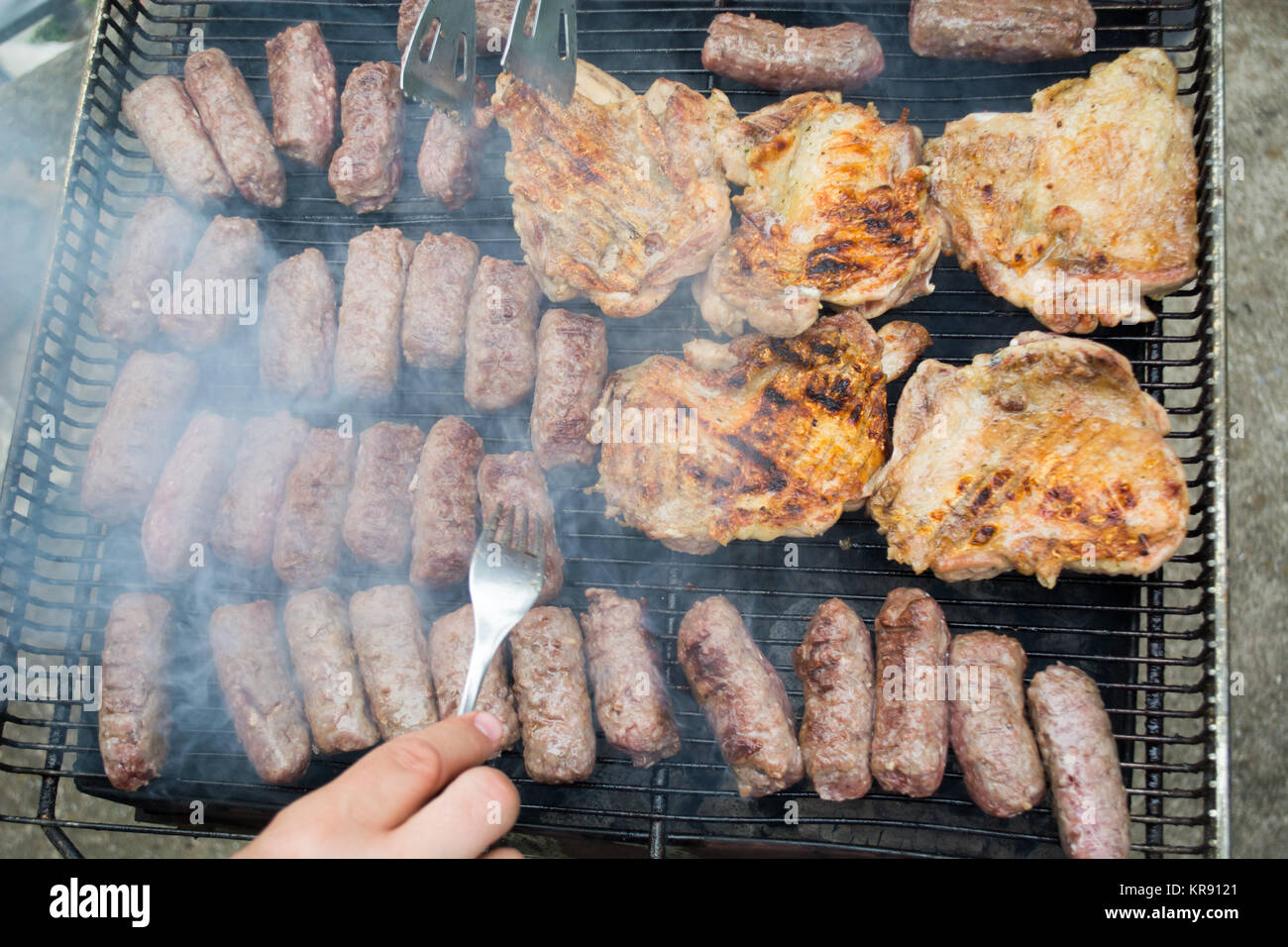 Grilling meat Stock Photo Alamy