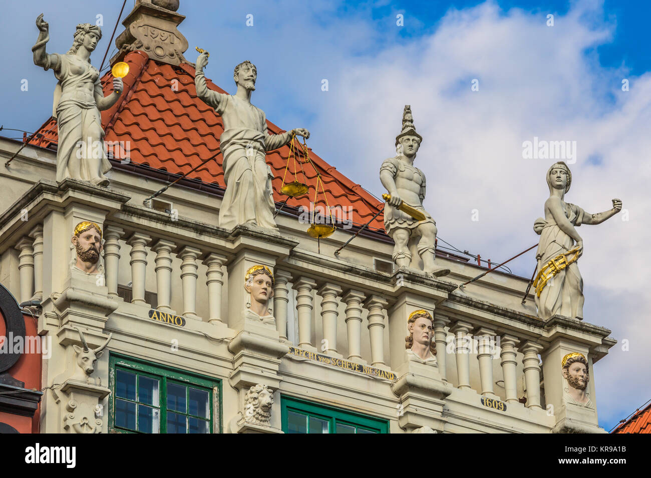 statue of justice with scales and a sword in the historic center of gdansk. Stock Photo