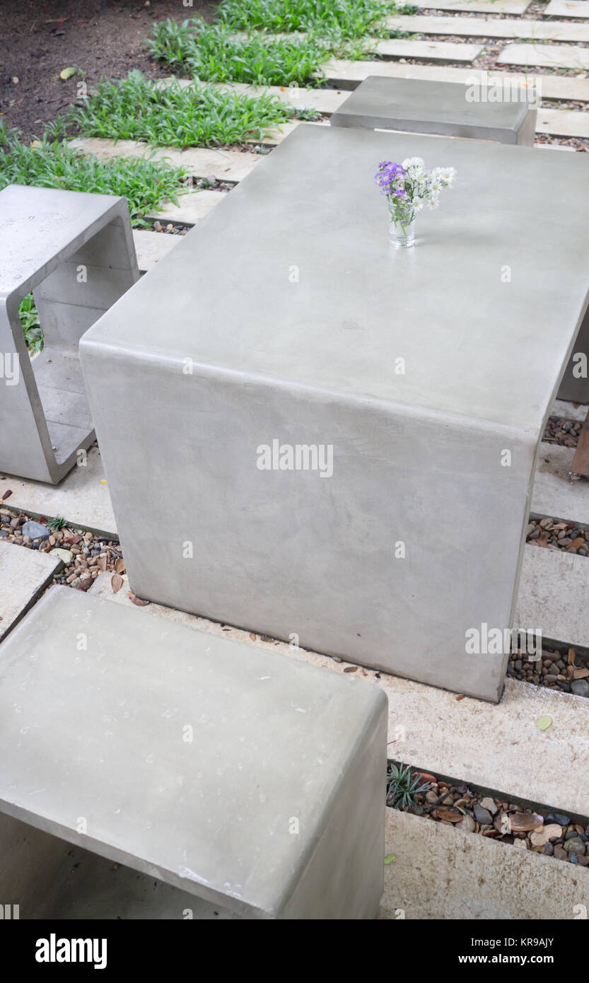 Concrete outdoor furniture set in the small garden Stock Photo Alamy