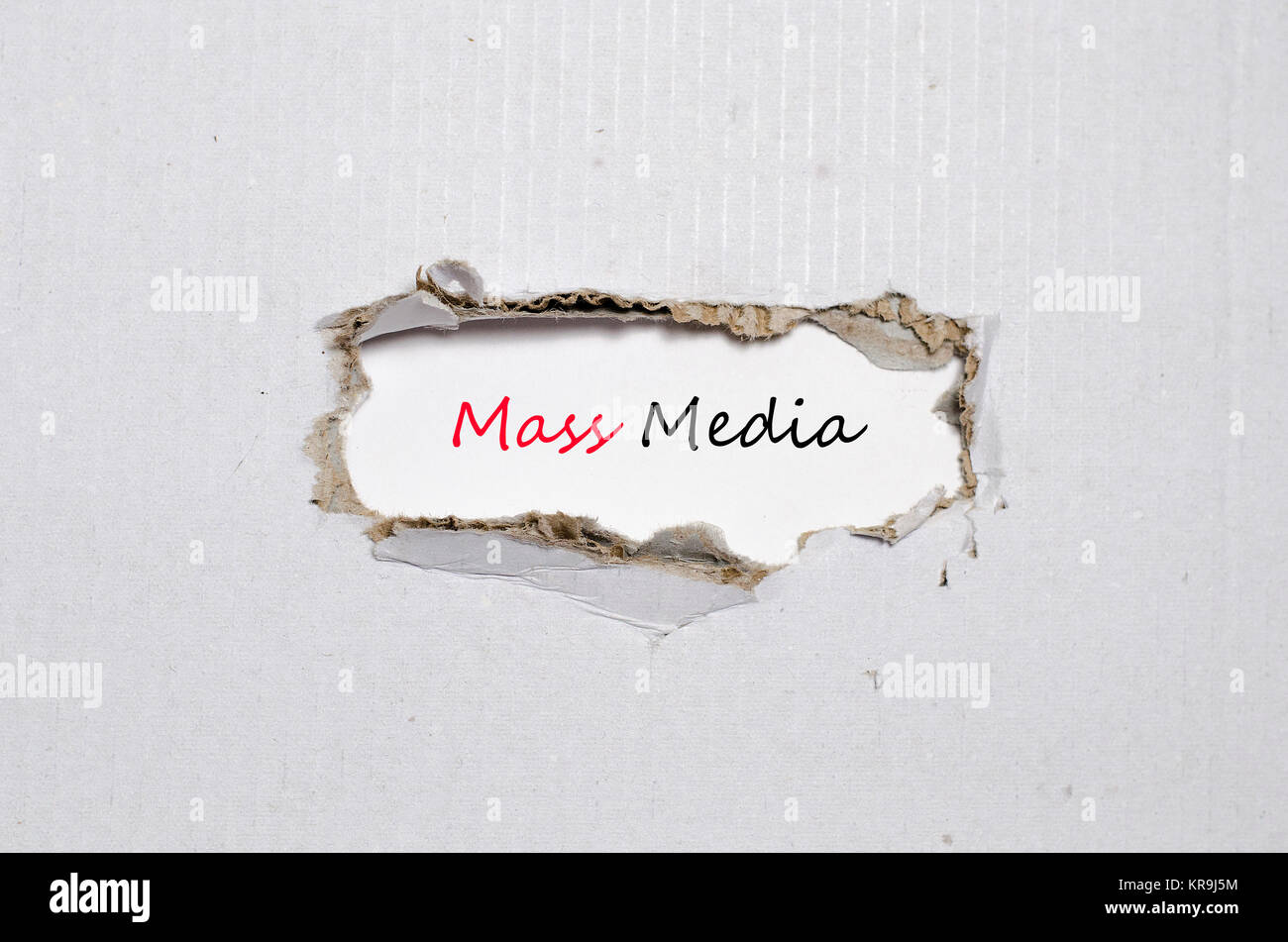 the-word-mass-media-appearing-behind-torn-paper-stock-photo-alamy