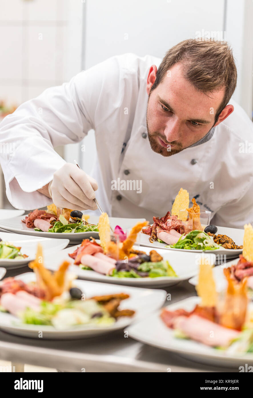 Chef decorating appetizer plate Stock Photo Alamy