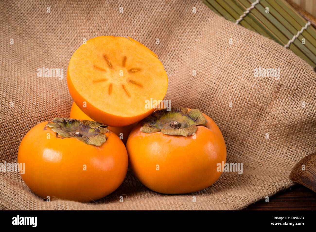 Organic and fresh persimmons Stock Photo