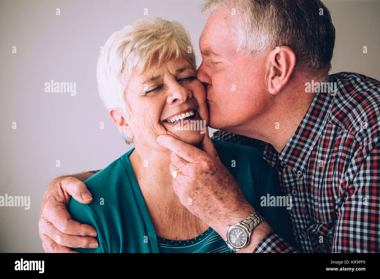 Young man kissing older woman hi-res stock photography and images - Alamy
