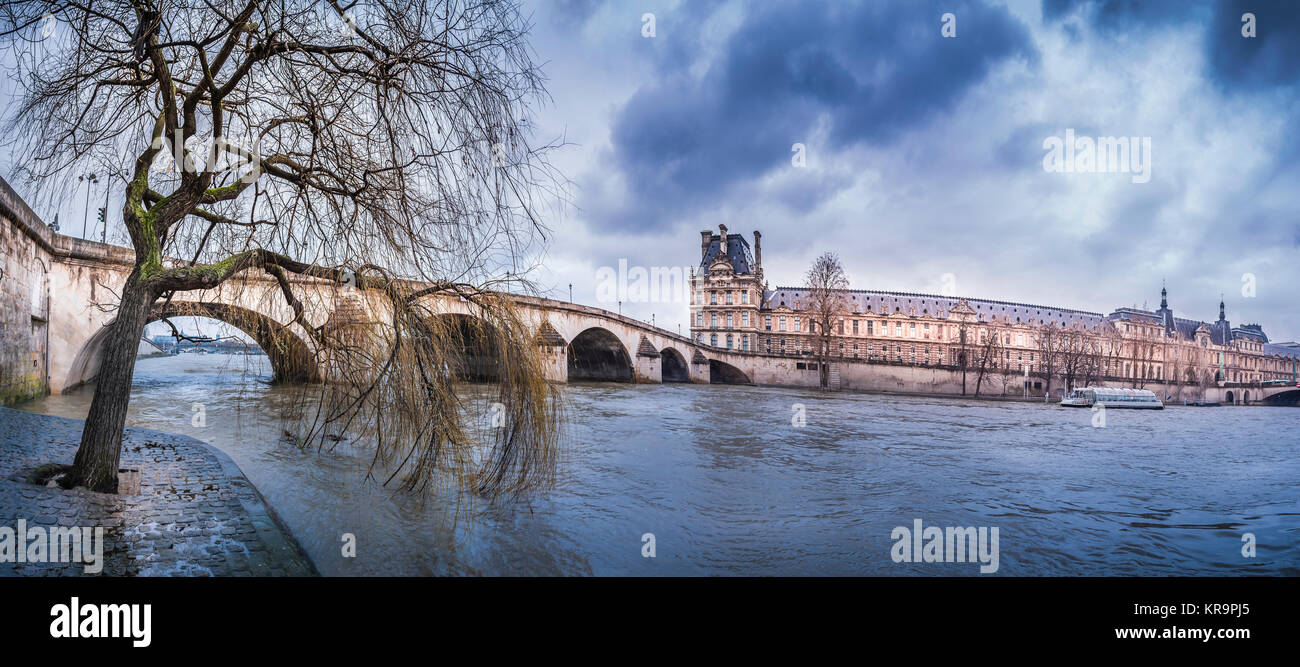 Dark clouds over Royal Bridge and Seine River Stock Photo