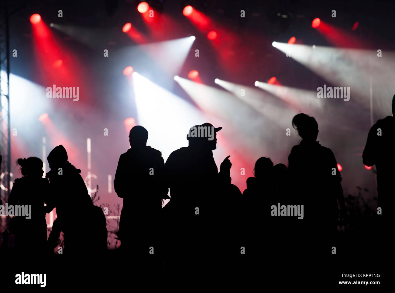 Cheering crowd in front of stage lights Stock Photo - Alamy
