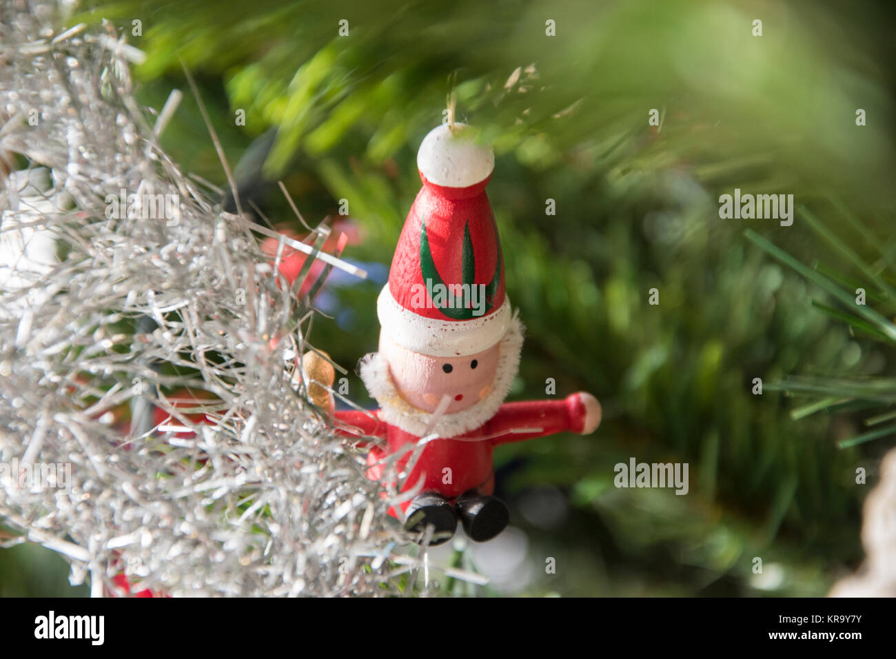 santa claus ornament hanging on christmas tree. Beautiful close up holiday photo. Stock Photo