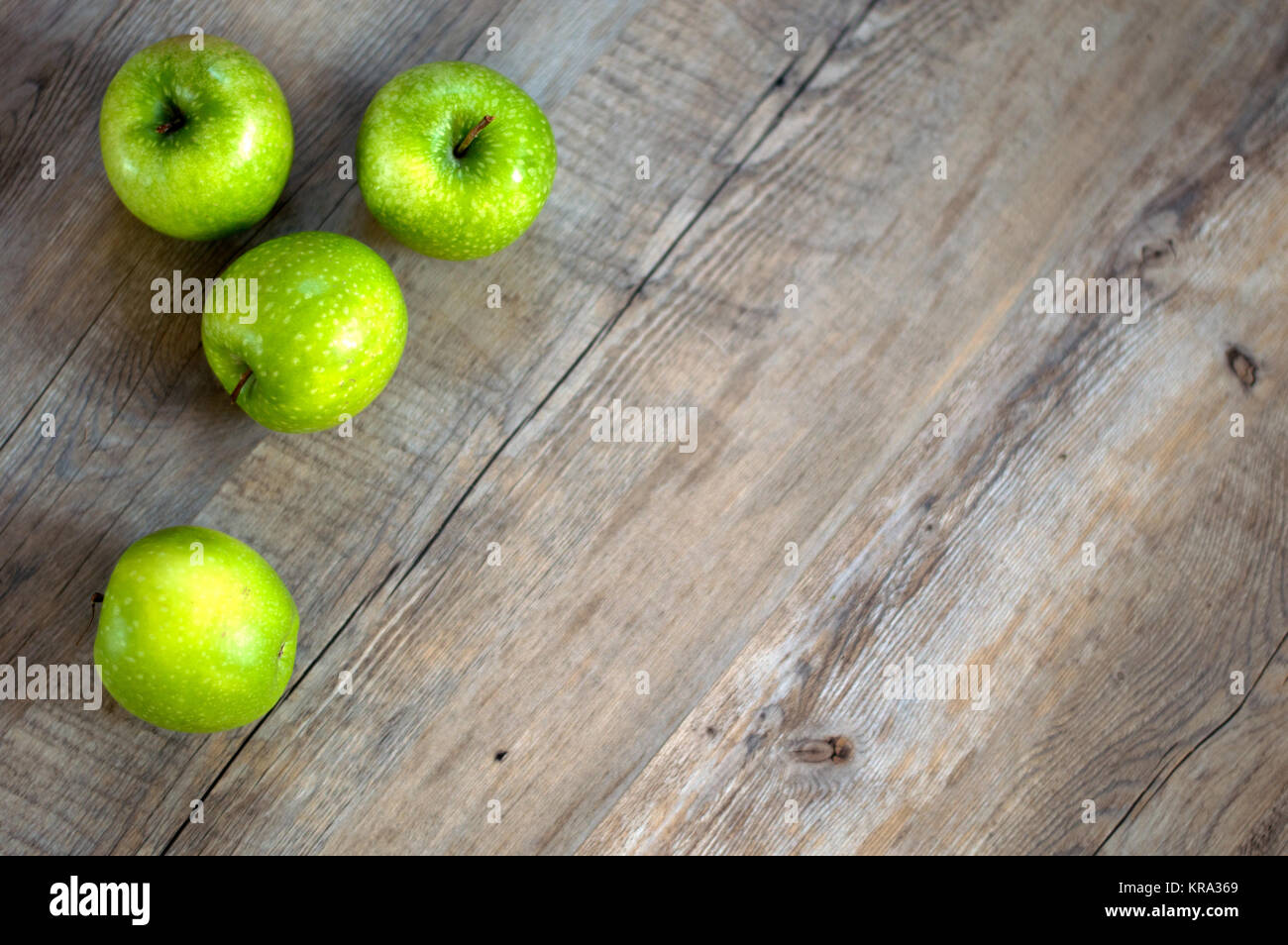 Granny Smith apples on a wooden background Stock Photo
