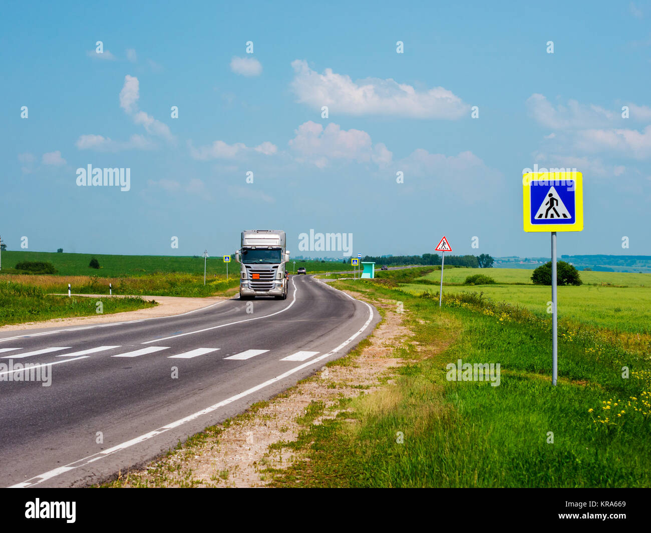 Zebra crossing, cars drive on road Stock Photo Alamy