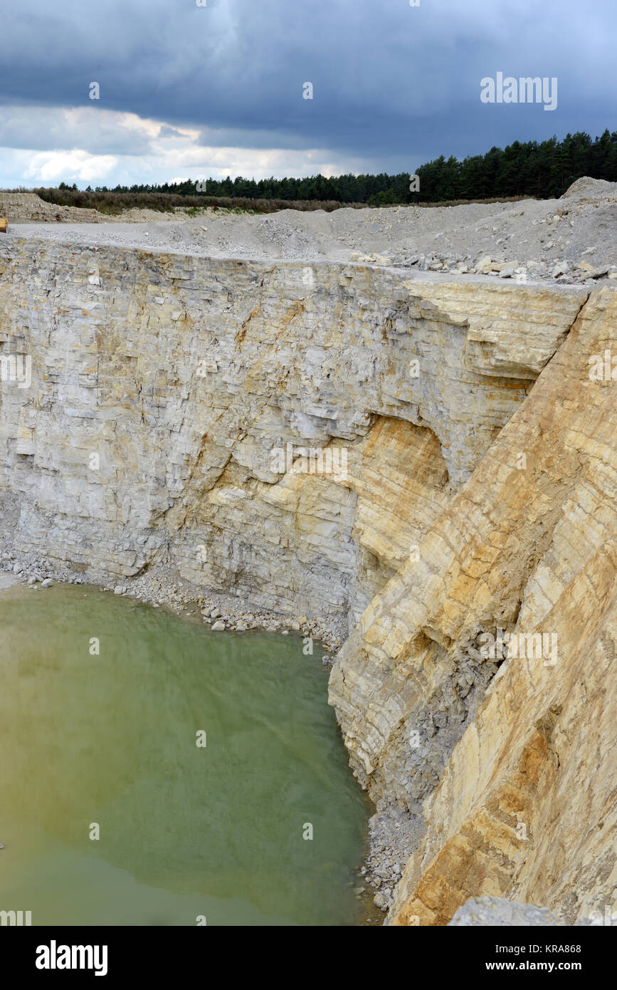 view into a limestone quarry with water on ground Stock Photo Alamy