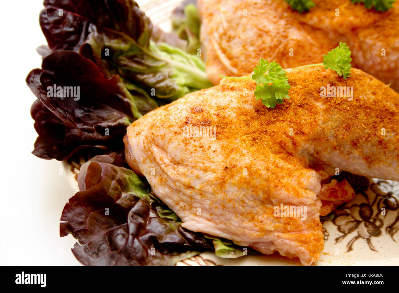Chickens thigh on salad leaf Stock Photo Alamy