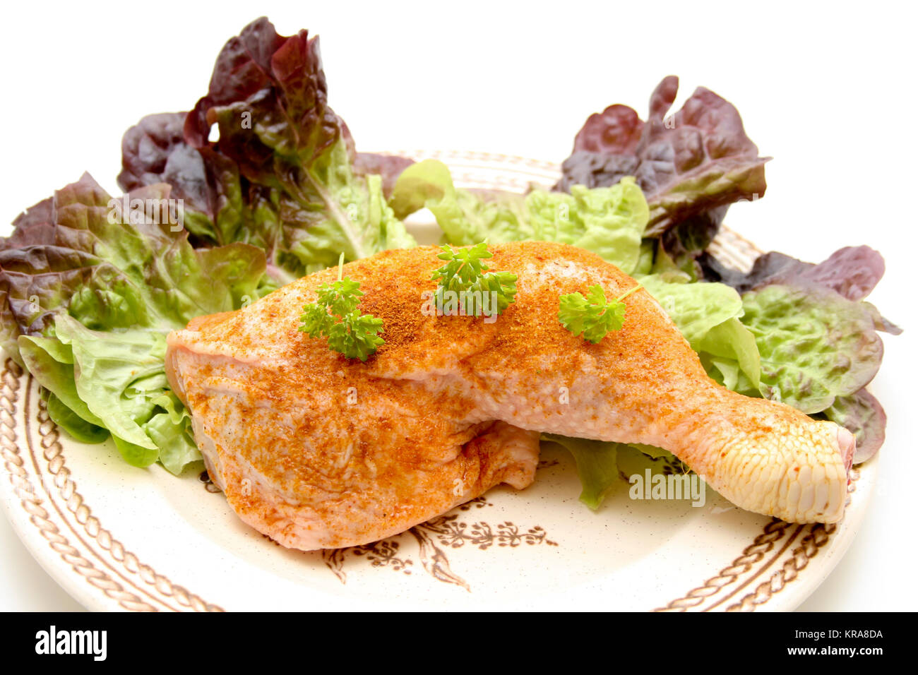 Chickens thigh on salad leaf Stock Photo Alamy