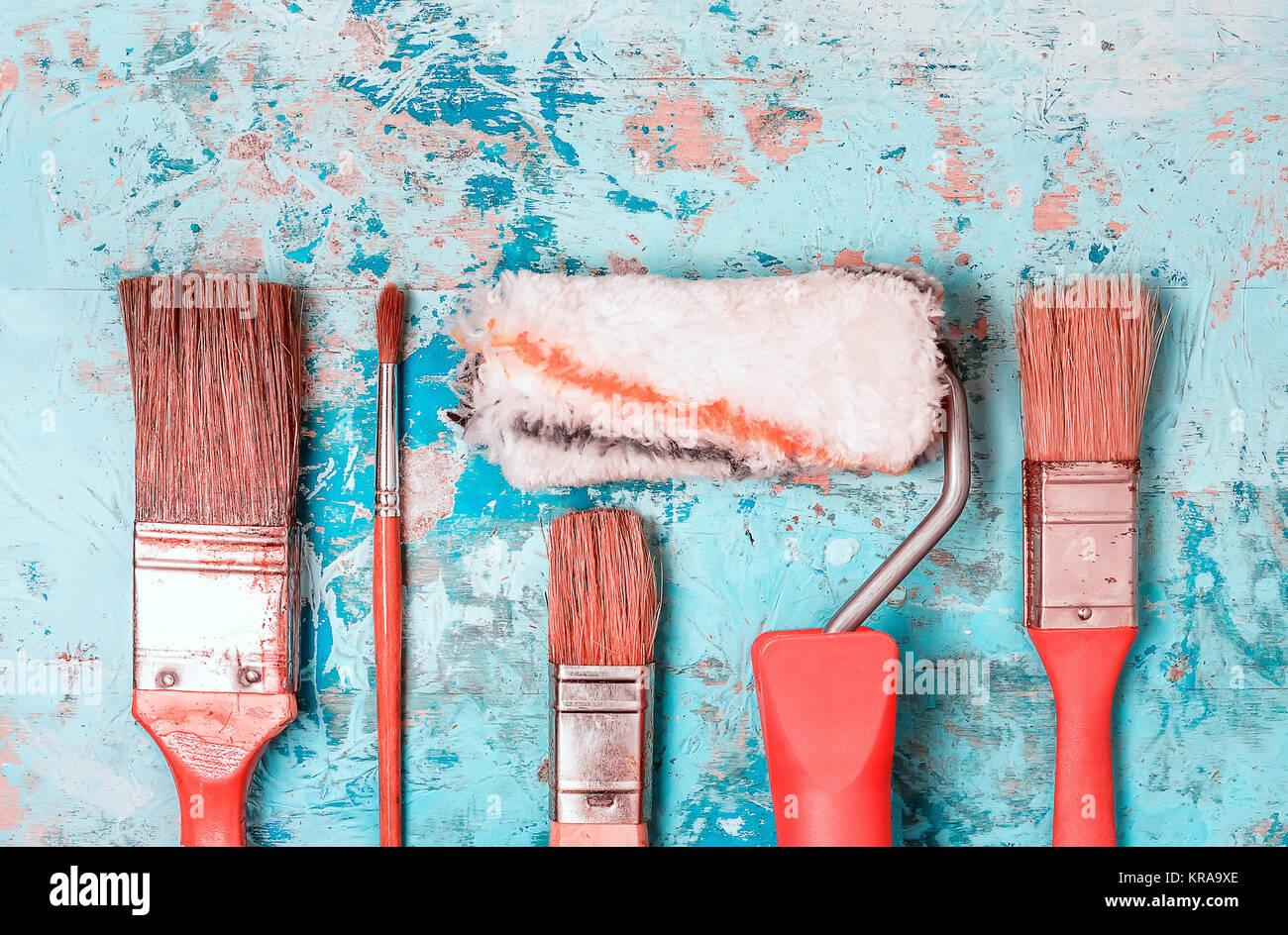 Set Of Paint Brushes On A Blue Wooden Background Stock Photo - Alamy