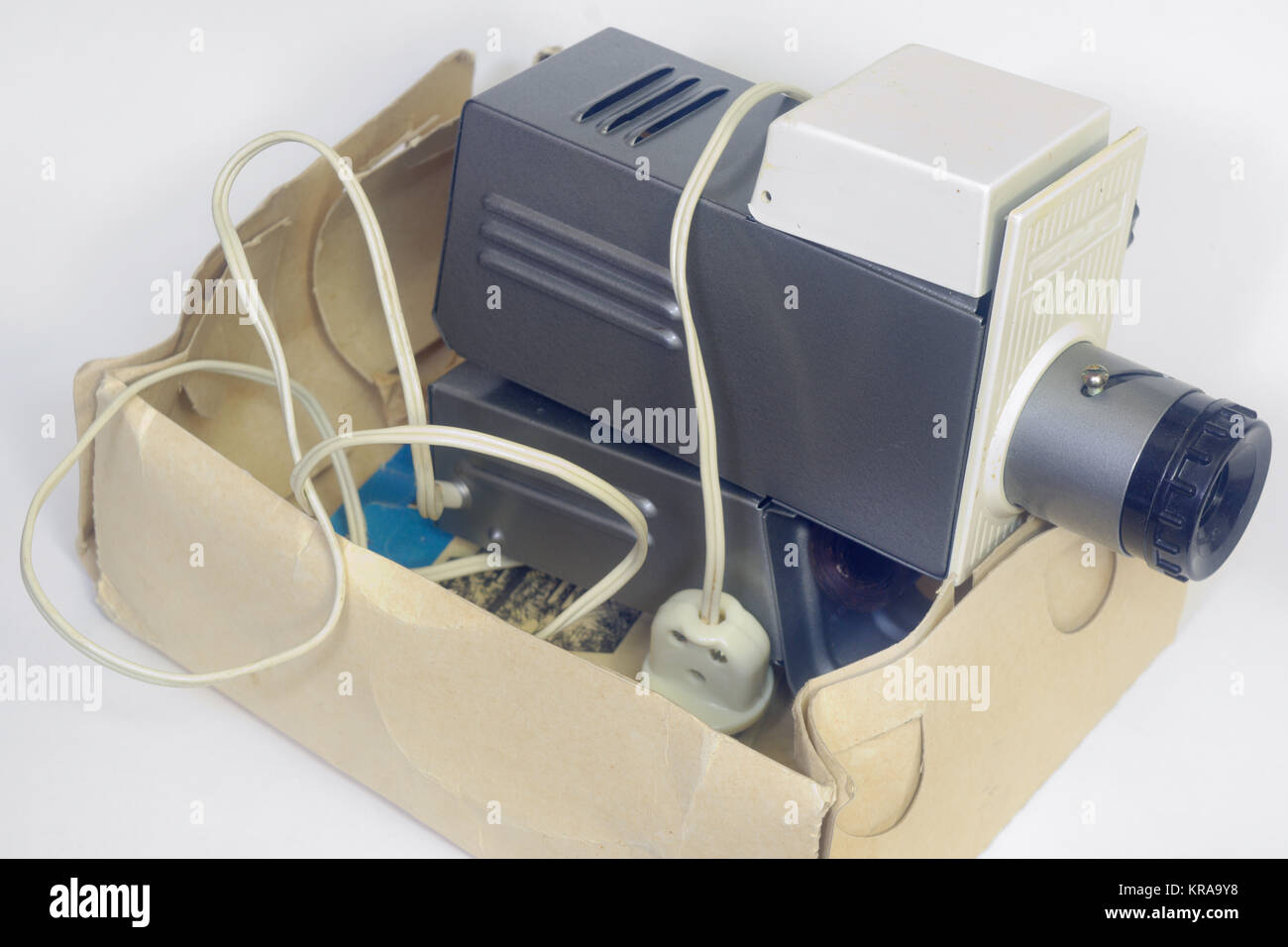 Old slide projector in a box. Loaded with film Stock Photo Alamy