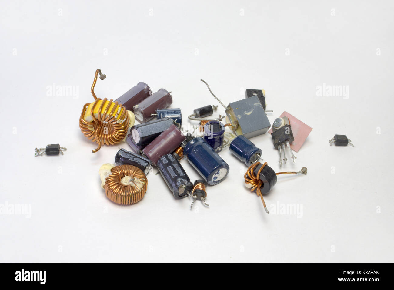 bunch of electronic parts: capacitors, transistors, inductors with toroid core, high-frequency inductance coil Stock Photo