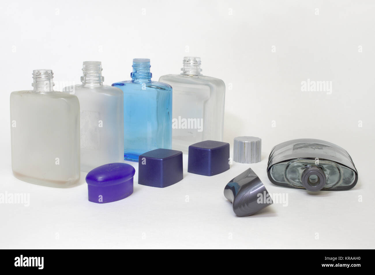 empty bottles of lotions after shave with open caps in a row Stock