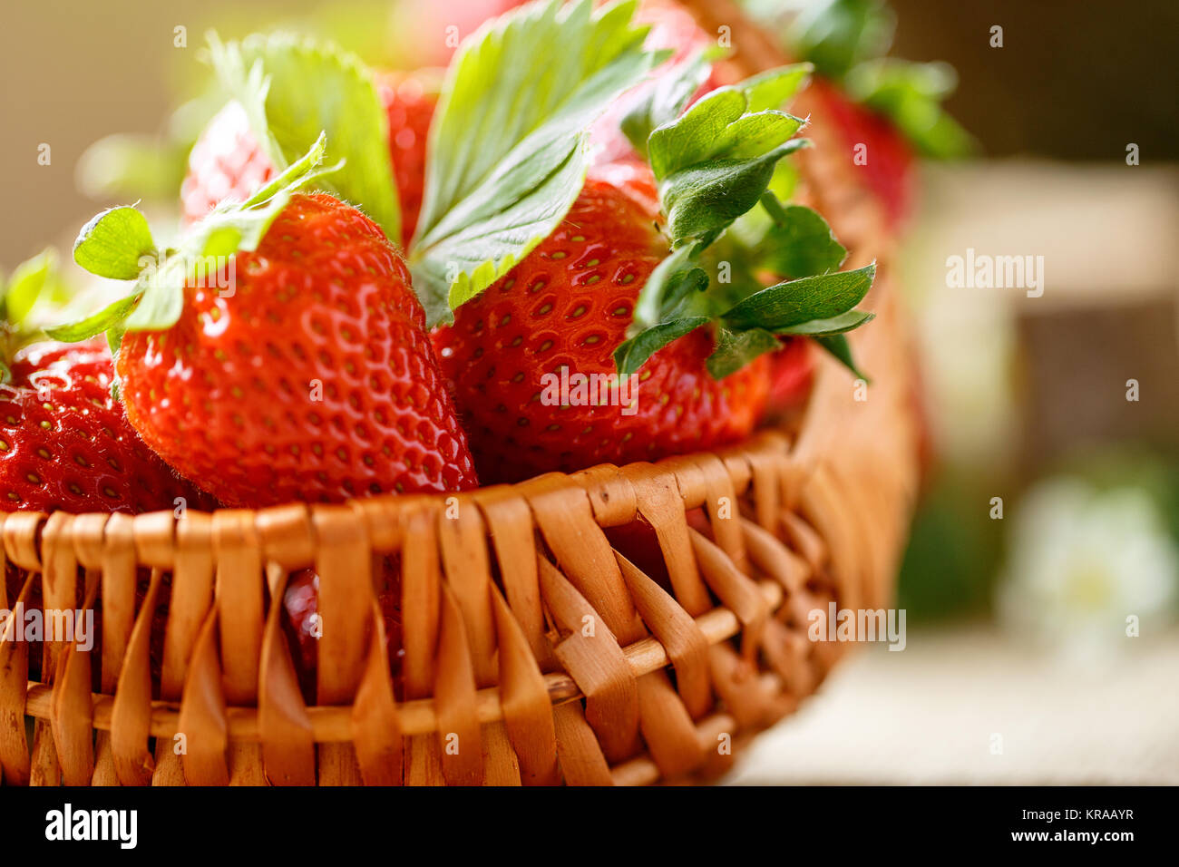 close up sweet red strawberries in basket background Stock Photo - Alamy