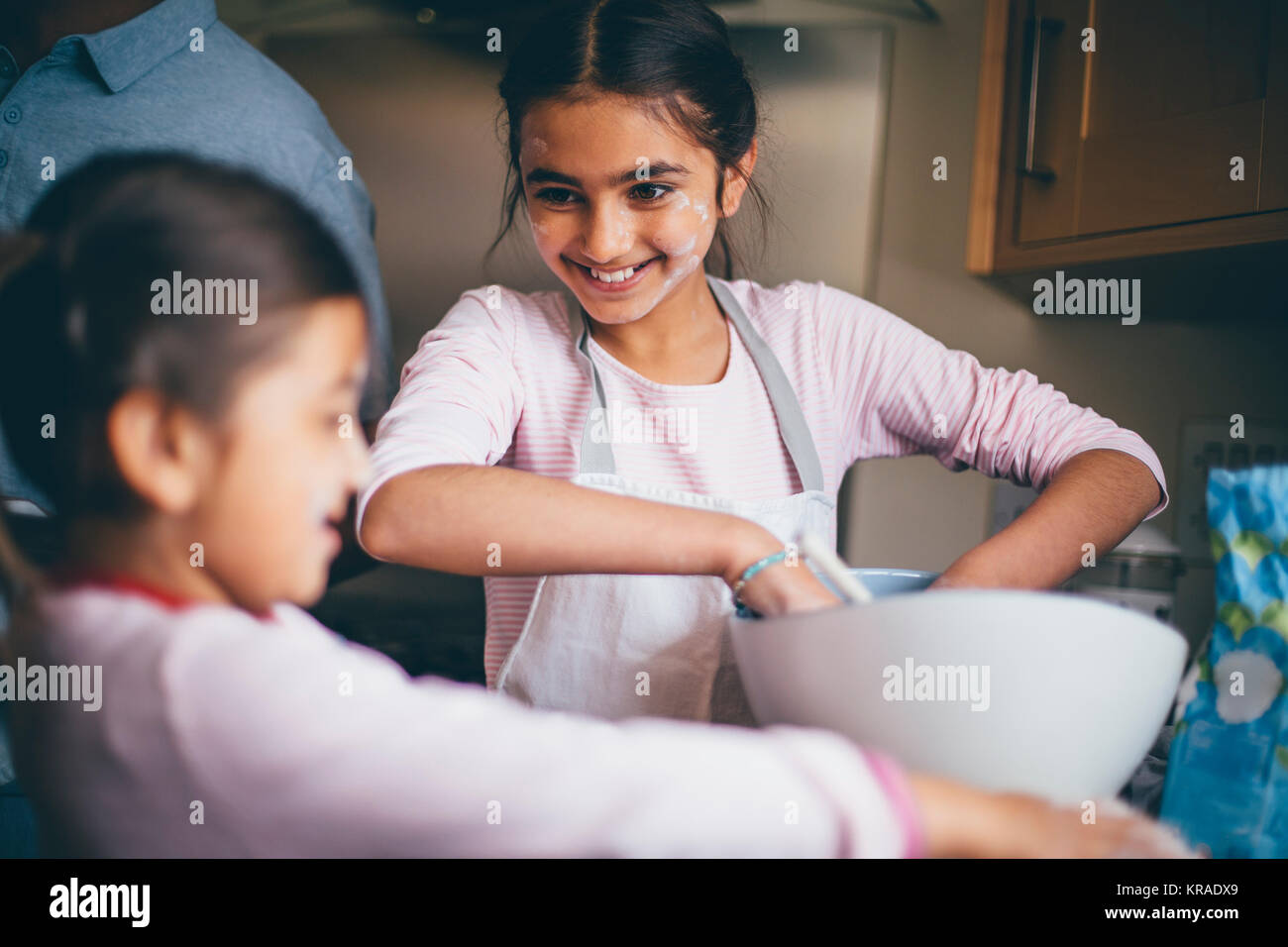 Sisters Making Biscuits Stock Photo Alamy