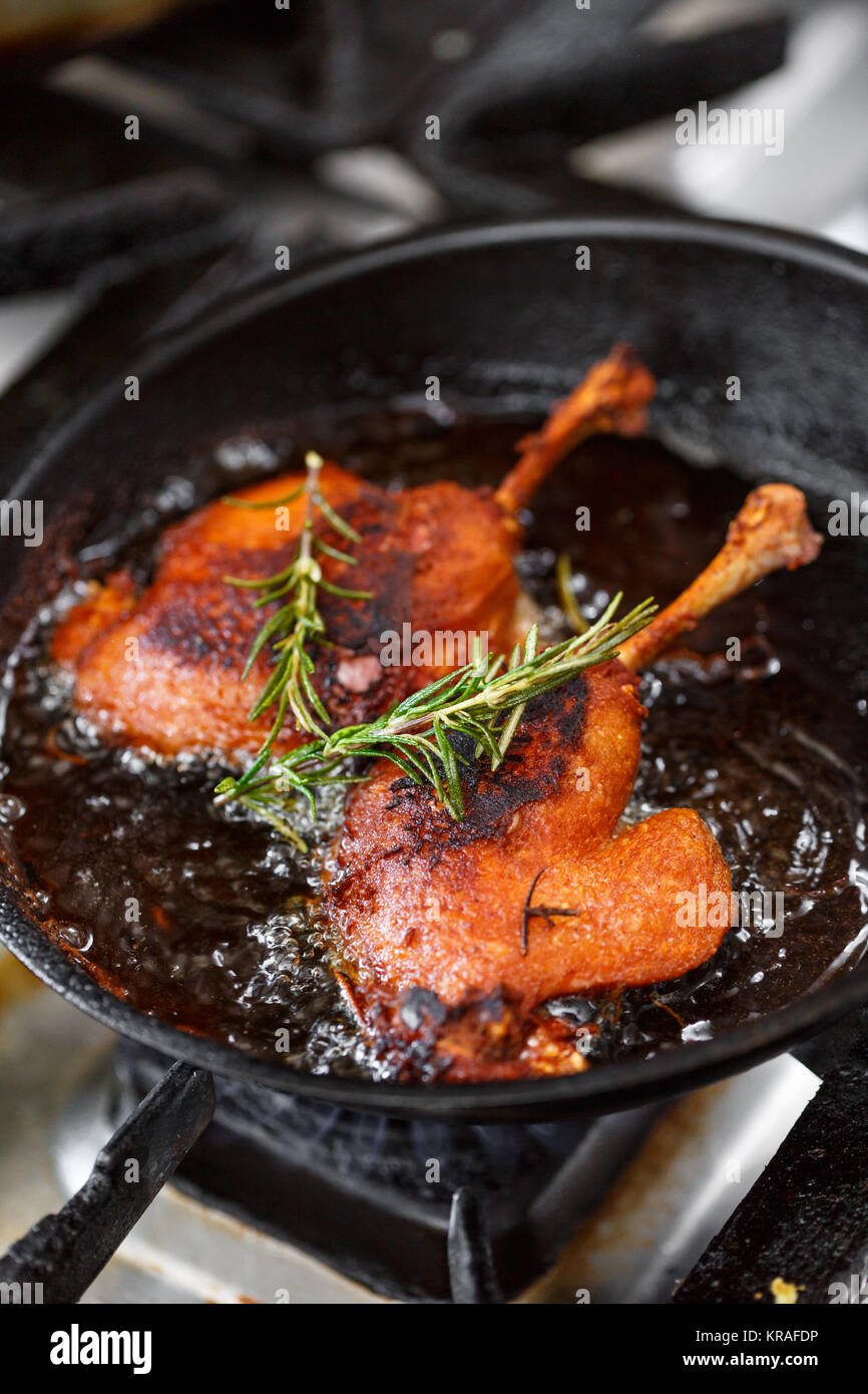 Duck legs frying Stock Photo - Alamy