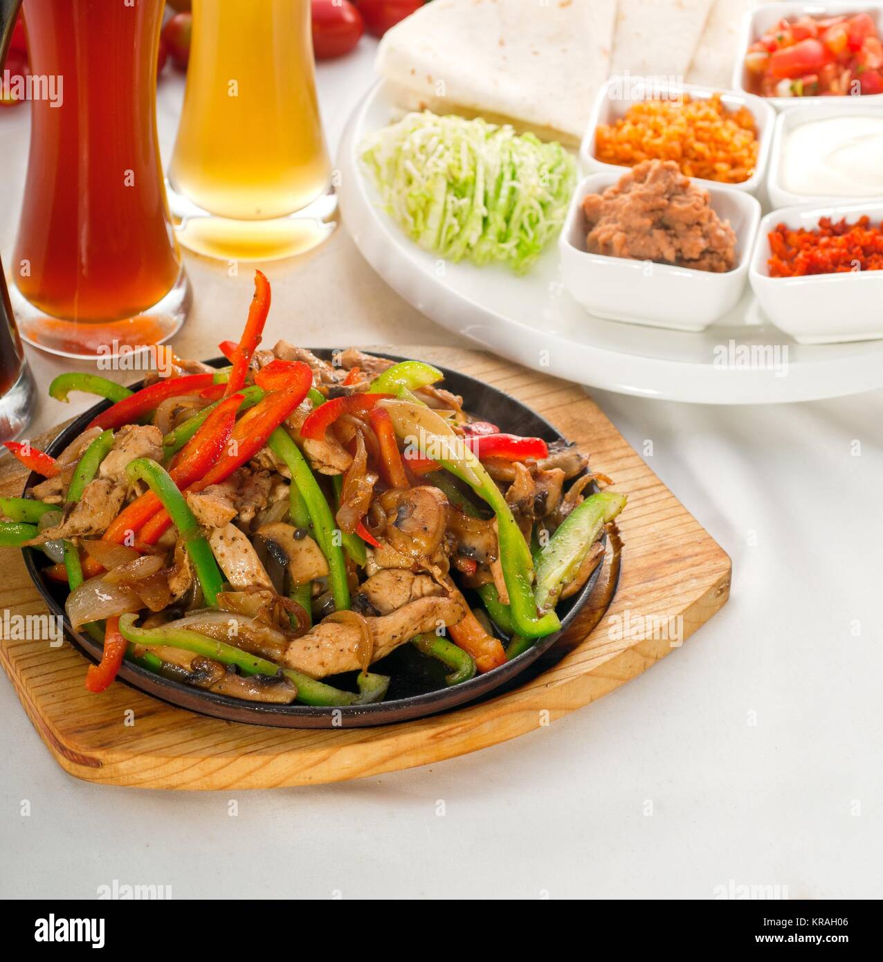 original fajita sizzling hot on iron plate Stock Photo Alamy