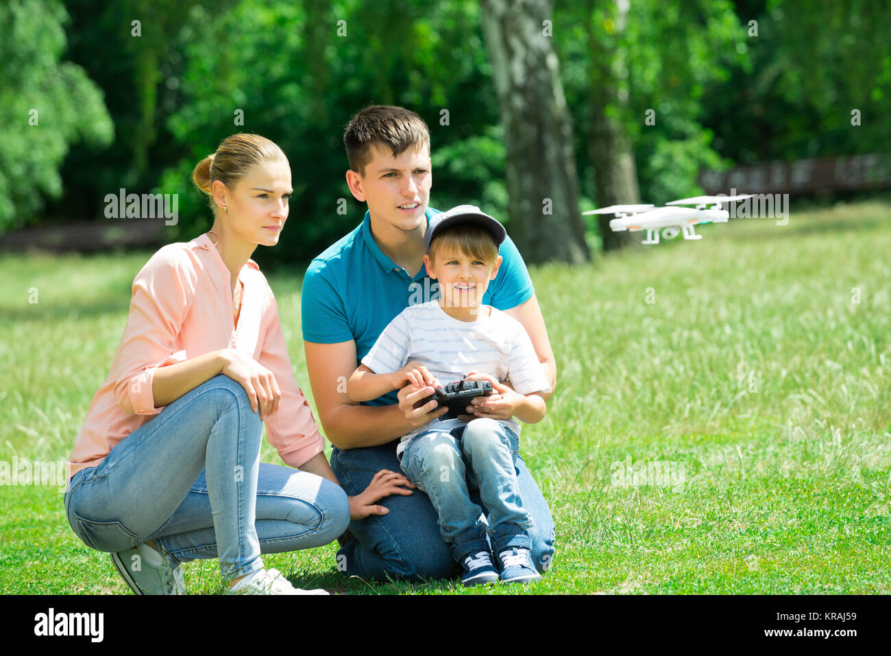 Family Flying Drone In The Park Stock Photo - Alamy