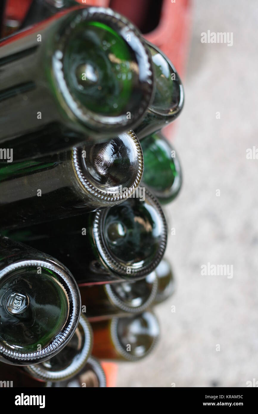 Green bottles bottoms, ready to be filled with wine. Isolated, vertical