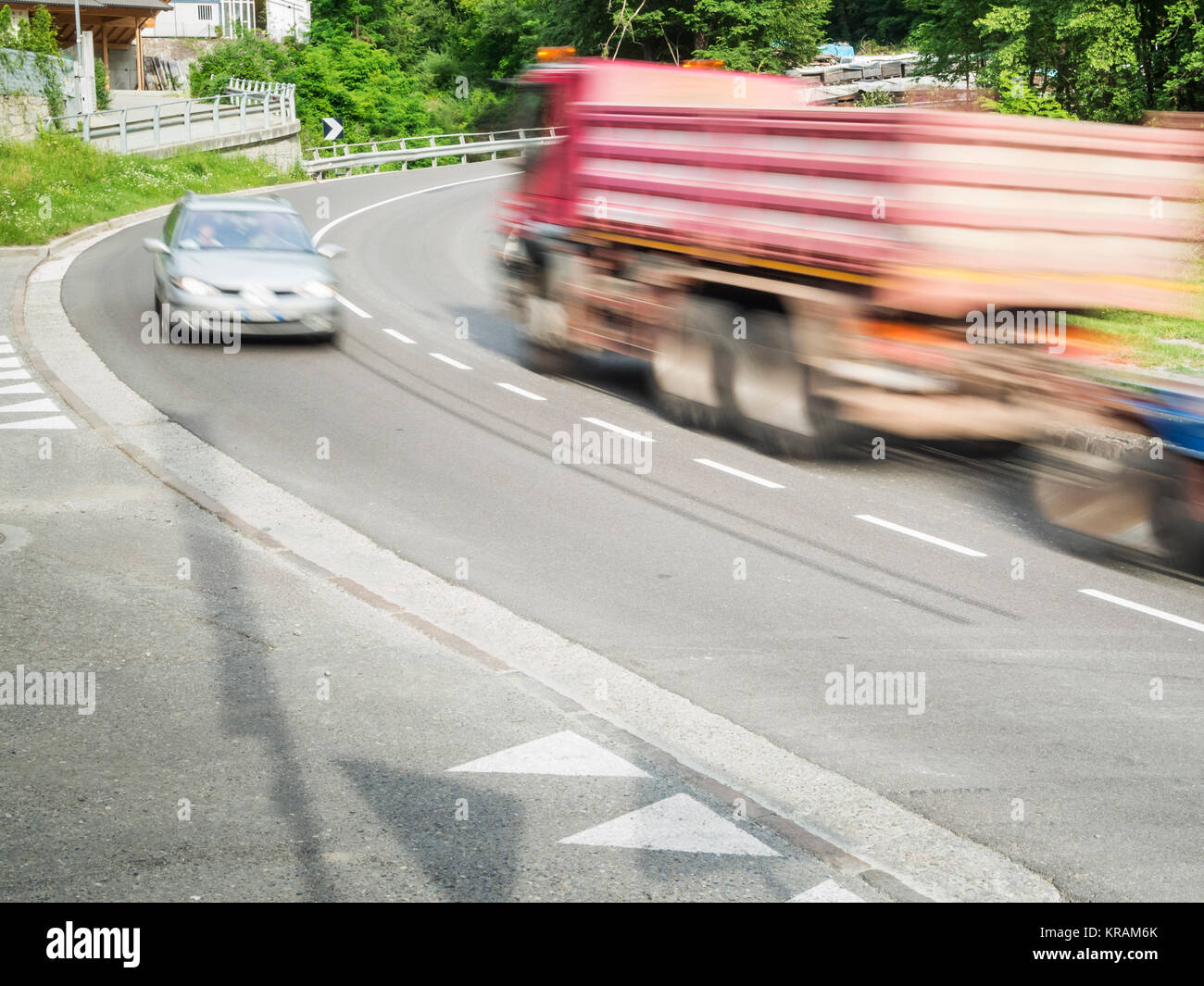 truck and car in the curve Stock Photo