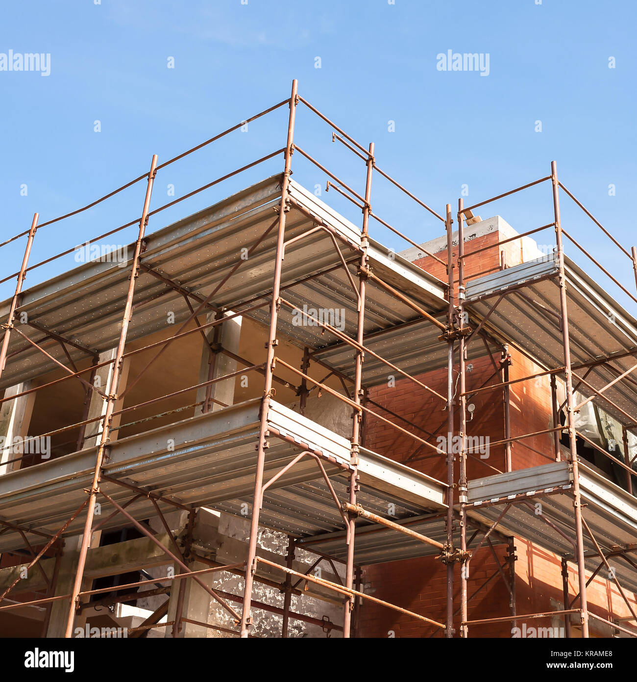 house for renovation with the scaffolding for bricklayers Stock Photo