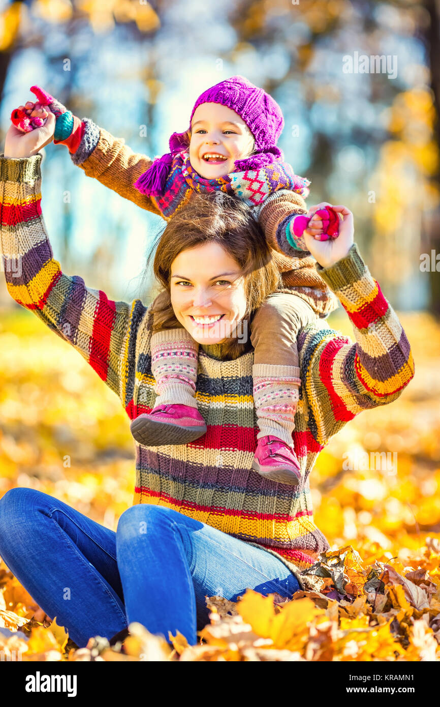 Mother and daughter playing in autumn park Stock Photo - Alamy
