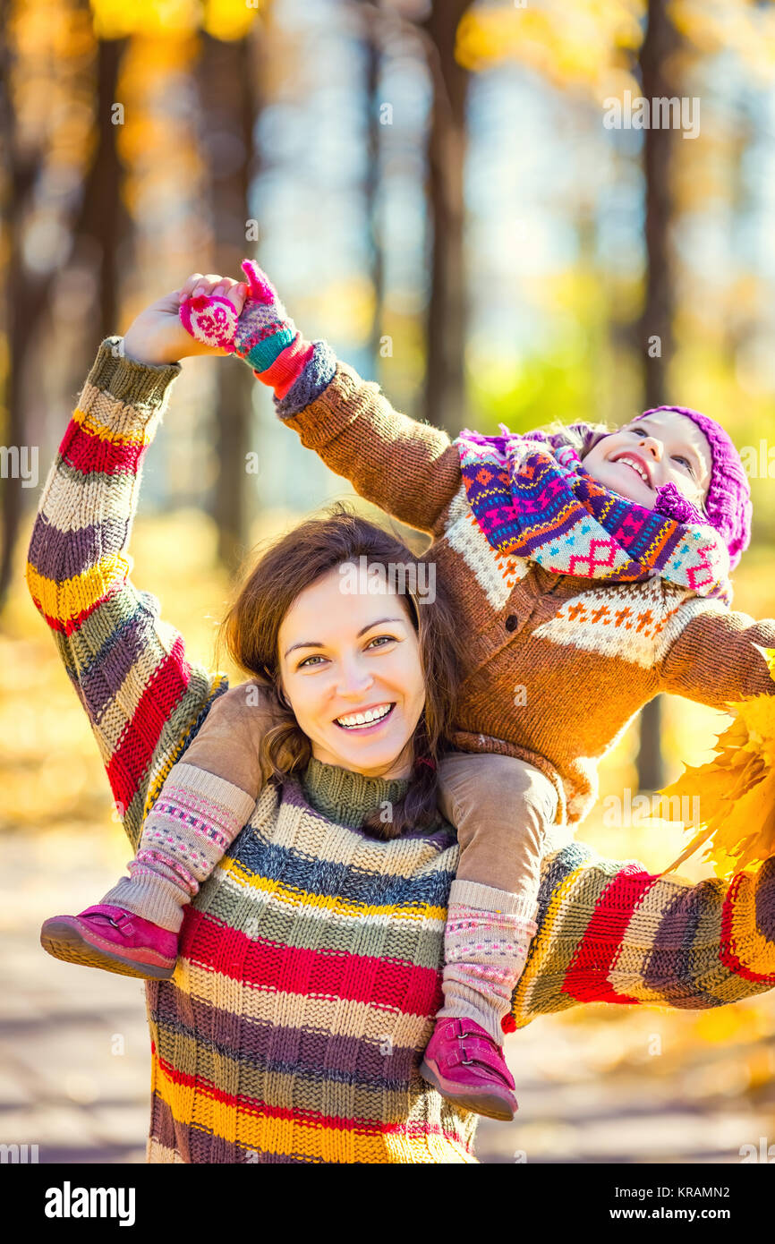 Mother and daughter playing in autumn park Stock Photo - Alamy