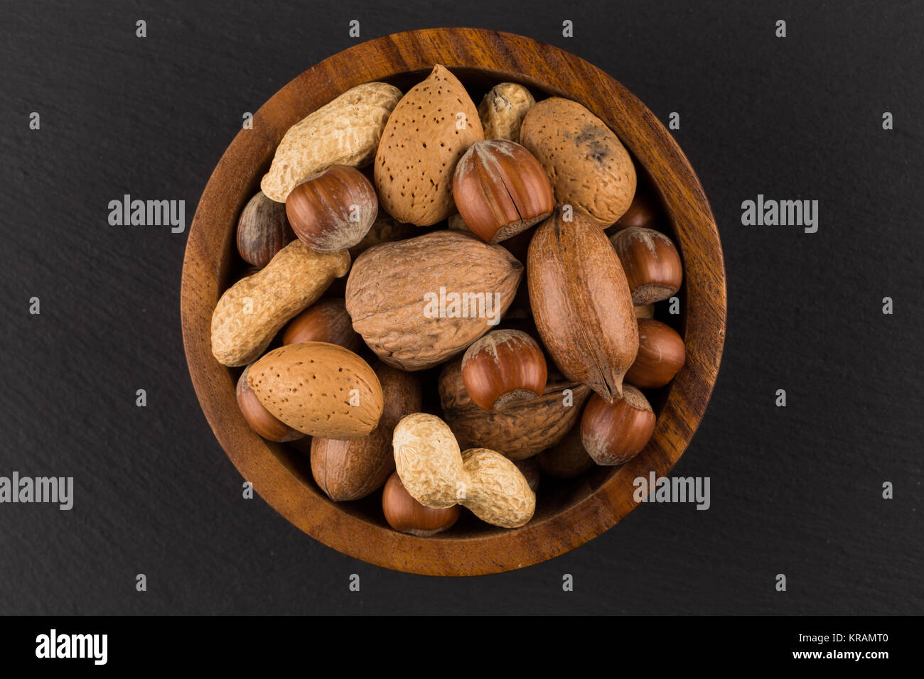 Mixed nuts in shells in a bowl Stock Photo Alamy