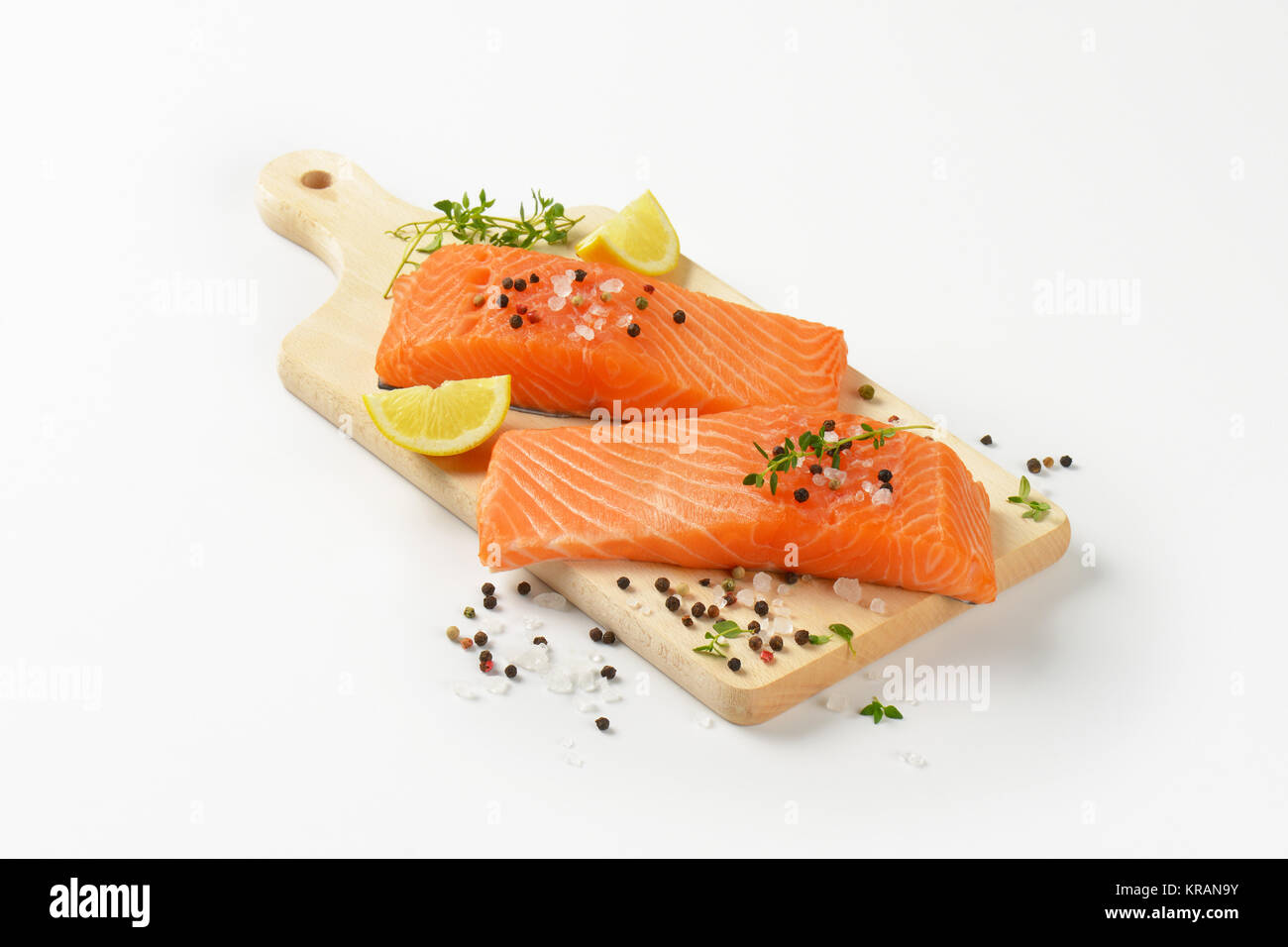 raw salmon fillets on cutting board Stock Photo - Alamy