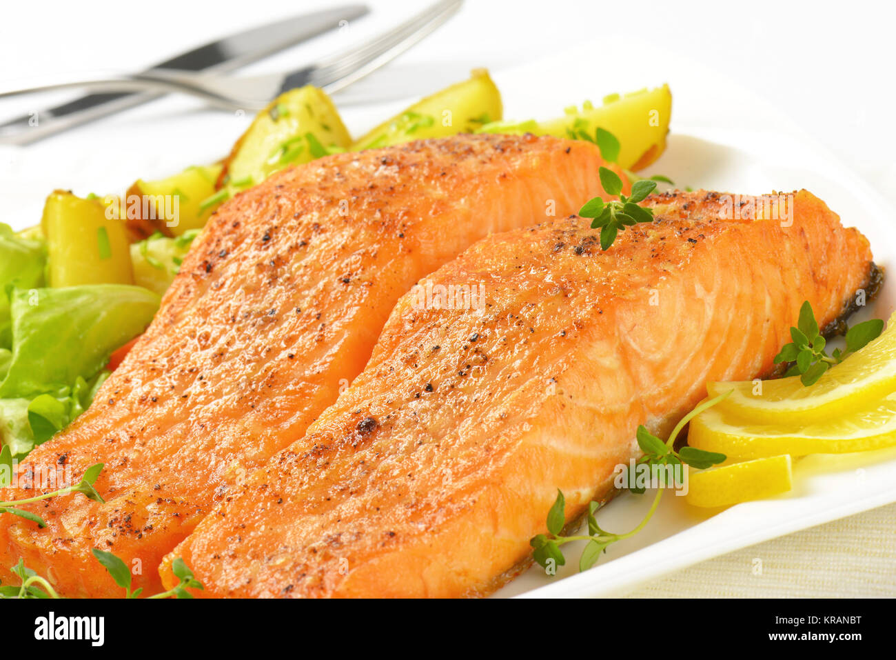 dish of salmon fillets with roasted potatoes Stock Photo Alamy