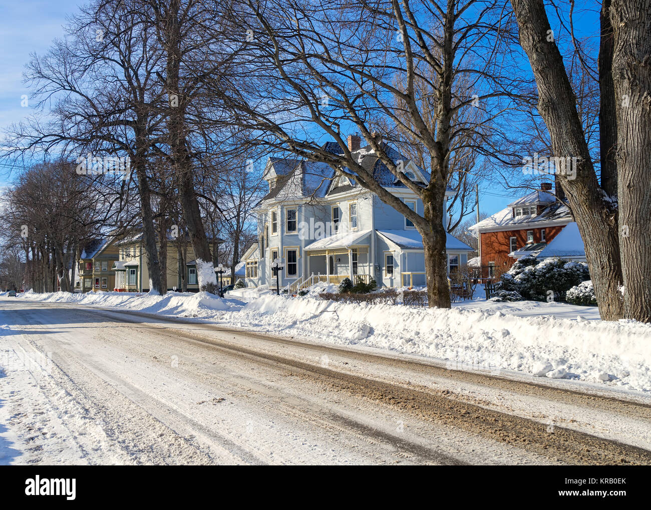 Older traditional homes in a snow covered residential neighborhood ...