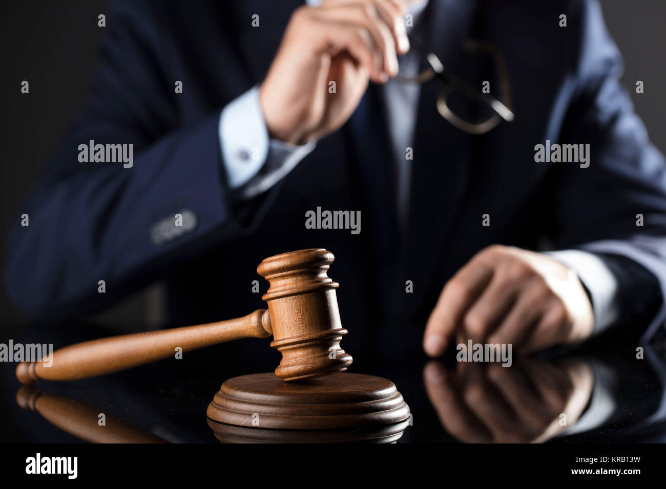 Judge in the courtroom. Gavel on the table. Law and justice theme. Stock Photo