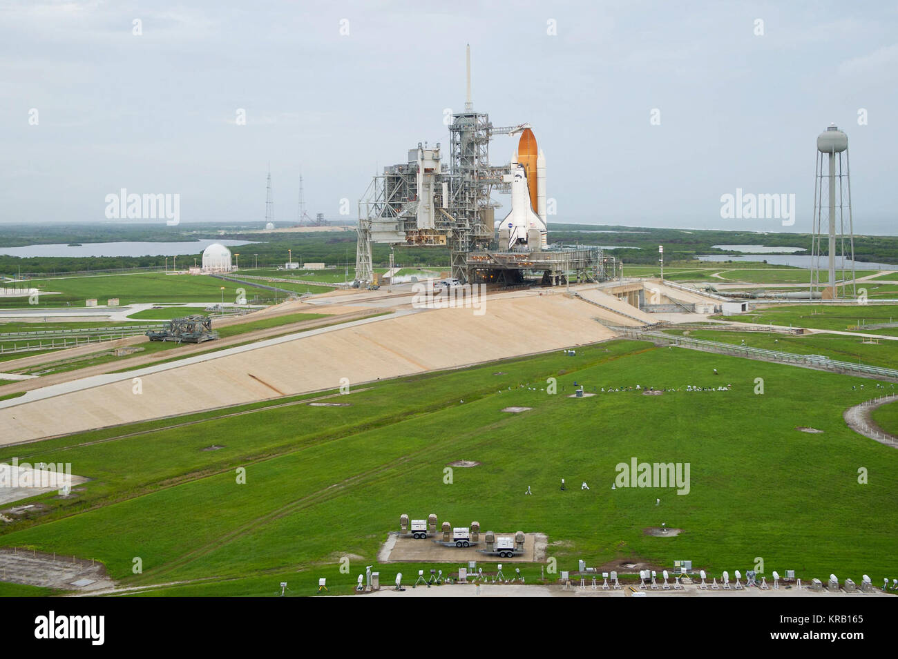 Space shuttle Atlantis is seen on launch pad 39a moments before the STS-135 crew arrives for their launch for the launch, Friday, July 8, 2011, at the NASA Kennedy Space Center in Cape Canaveral, Fla. The launch of Atlantis, STS-135, is the final flight of the shuttle program, a 12-day mission to the International Space Station.  Photo Credit: (NASA/Bill Ingalls) Shuttle Atlantis moments before STS-135 crew boards Stock Photo