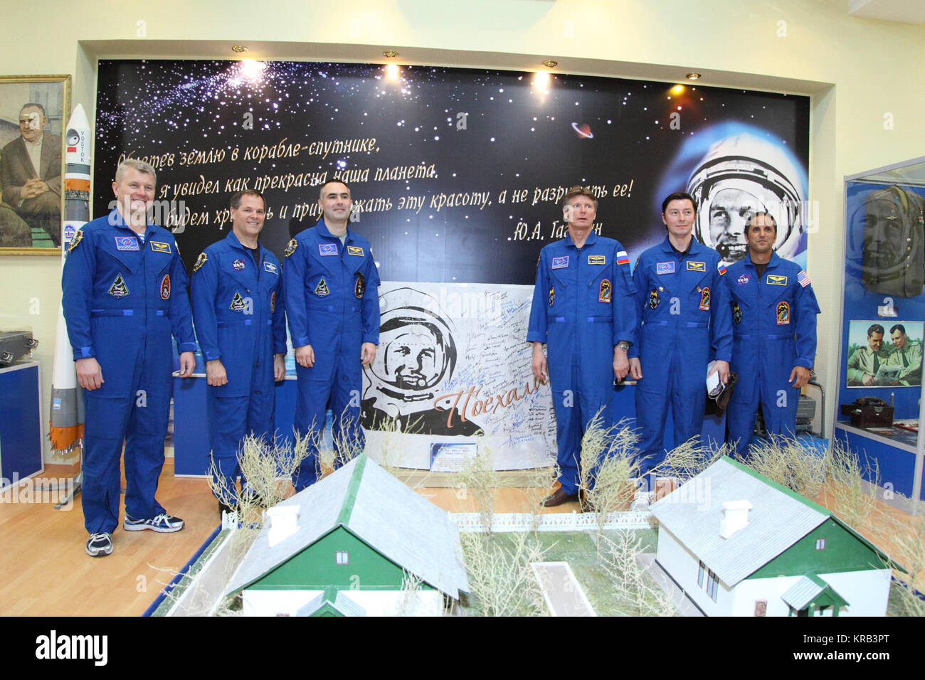 At the historic museum near the launch pad at the Baikonur Cosmodrome in Kazakhstan, the Expedition 31/32 backup and prime crews pose for pictures May 11, 2012 in front of the mural depicting the likeness of Yuri Gagarin, the first human to fly in space. The photo session took place as training for the launch of Soyuz Commander Gennady Padalka, Flight Engineer Joe Acaba of NASA and Flight Engineer Sergei Revin drew to a close for their liftoff May 15 in their Soyuz TMA-04 spacecraft to begin a four-month mission on the International Space Station. From left to right are backup crewmembers Oleg Stock Photo