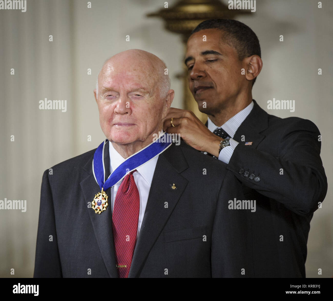 President Barack Obama presents former United States Marine Corps pilot, astronaut, and United States Senator John Glenn with a Medal of Freedom, Tuesday, May 29, 2012, during a ceremony at the White House in Washington. Photo Credit: (NASA/Bill Ingalls) Glenn Obama Medal Stock Photo