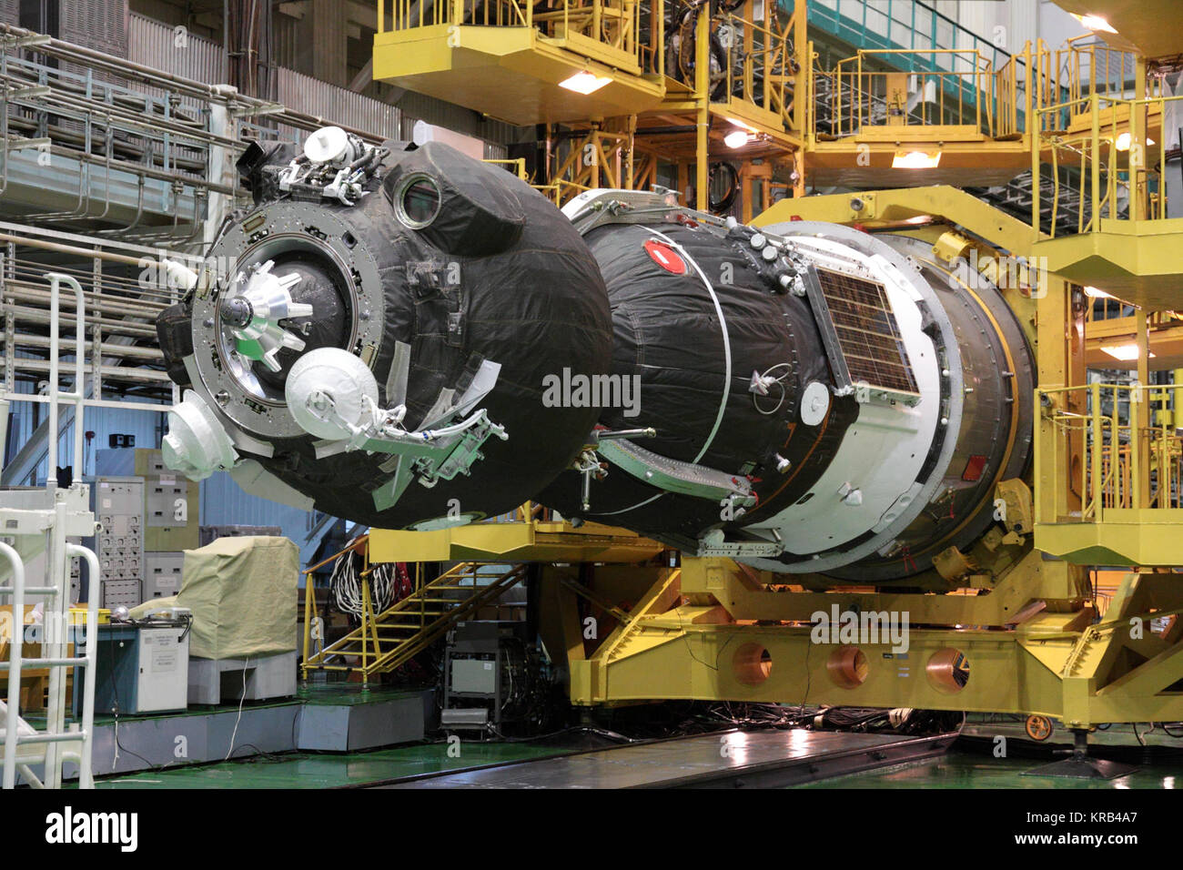 At the Baikonur Cosmodrome in Kazakhstan, the Soyuz TMA-05M spacecraft is readied for its encapsulation into the upper stage of its Soyuz booster July 8, 2012 in advance of its rollout to the launch pad July 12 and the launch of its occupants, Expedition 32/33 Soyuz Commander Yuri Malenchenko, NASA Flight Engineer Sunita Williams and Flight Engineer Aki Hoshide of the Japan Aerospace Exploration Agency July 15 for a four-month mission on the International Space Station.  NASA/Victor Zelentsov Soyuz TMA-05M spacecraft integration facility 2 Stock Photo