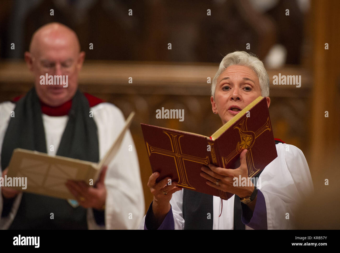 The Rev. Gina Gilland Campbell, acting director of worship, Washington National Cathedral, reads the Gospel during a memorial service celebrating the life of Neil Armstrong at the Washington National Cathedral, Thursday, Sept. 13, 2012. Armstrong, the first man to walk on the moon during the 1969 Apollo 11 mission, died Saturday, Aug. 25. He was 82. Photo Credit: (NASA/Paul E. Alers) Neil Armstrong public memorial service (201209130014HQ) Stock Photo