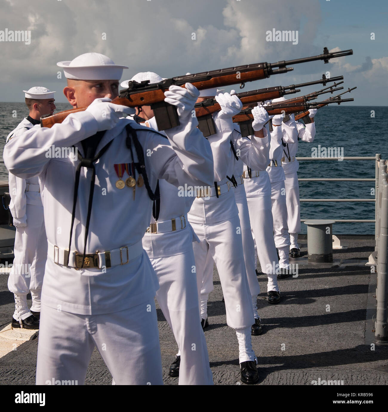 A US Navy firing squad fires three volleys in honor of Neil Armstrong during his burial at sea service aboard the USS Philippine Sea (CG 58), Friday, Sept. 14, 2012, in the Atlantic Ocean. Armstrong, the first man to walk on the moon during the 1969 Apollo 11 mission, died Saturday, Aug. 25. He was 82. Photo Credit: (NASA/Bill Ingalls) Neil Armstrong burial at sea (201209140016HQ) Stock Photo