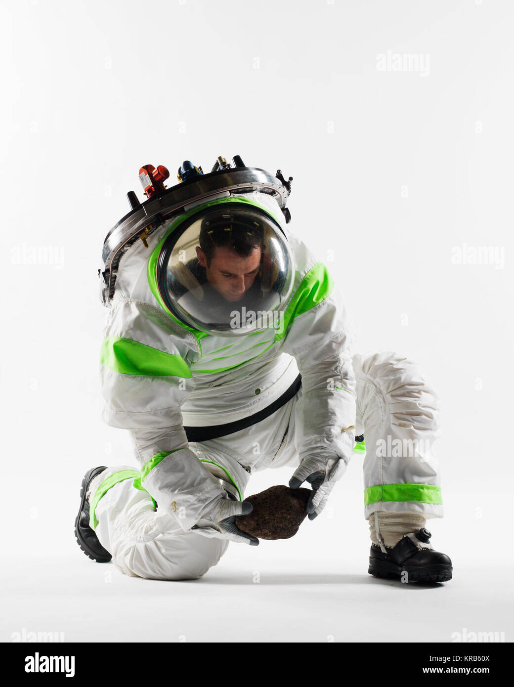 Space Suit Engineer Richard Rhodes demonstrates the Z-1 Protoype Exploration Suit in the Advanced Suit Lab in Building 34.  Photo Date: November 7, 2012.  Location: Building 34, Advanced Suit Lab.  Photographer: Robert Markowitz Z-1 Spacesuit Prototype - kneeling Nov 2012 Stock Photo