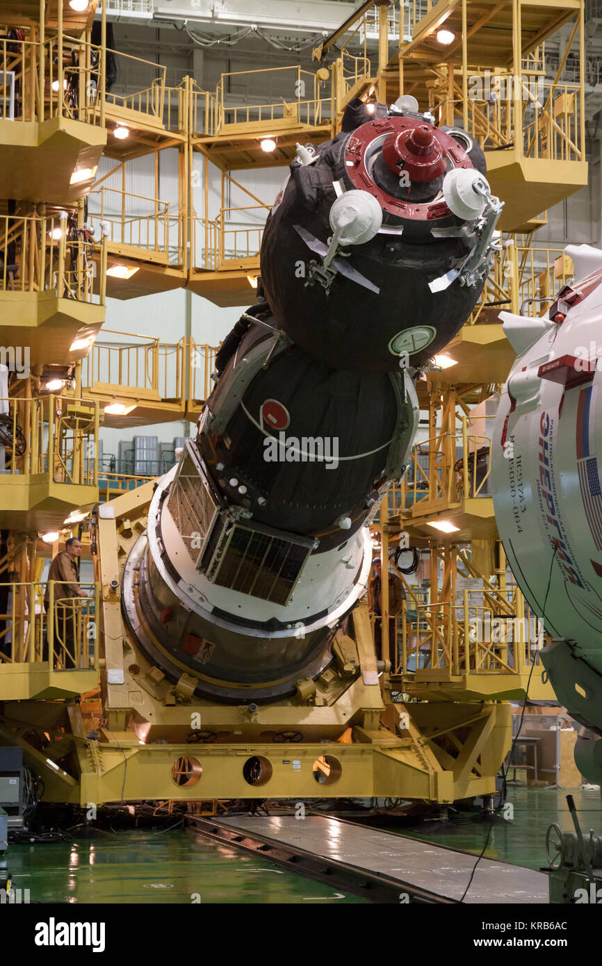In the Integration Facility at the Baikonur Cosmodrome in Kazakhstan, the Soyuz TMA-07M spacecraft is lowered into place for its encapsulation into the upper stage of the Soyuz booster Dec. 12, 2012 as preparations continue for the launch of the Expedition 34/35 crew. The vehicle will be rolled to the launch pad at Baikonur Dec. 17 in advance of the Dec. 19 launch of NASA Flight Engineer Tom Marshburn, Soyuz Commander Roman Romanenko and Flight Engineer Chris Hadfield of the Canadian Space Agency for a five-month mission on the International Space Station. Photo Credit: NASA/Victor Zelentsov S Stock Photo