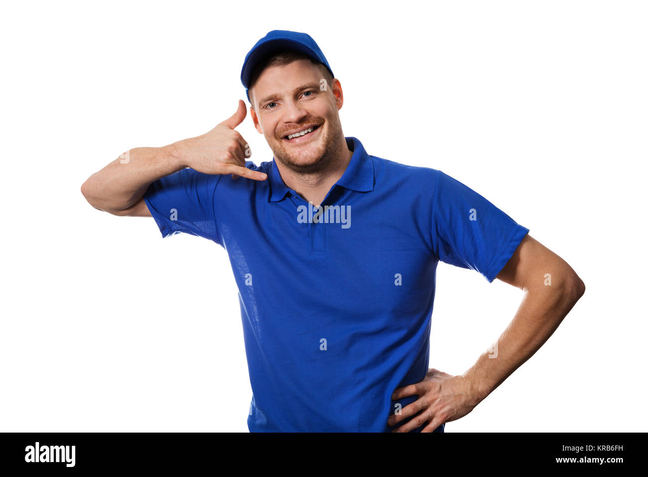 handyman services - worker in blue uniform making phone call gesture Stock Photo