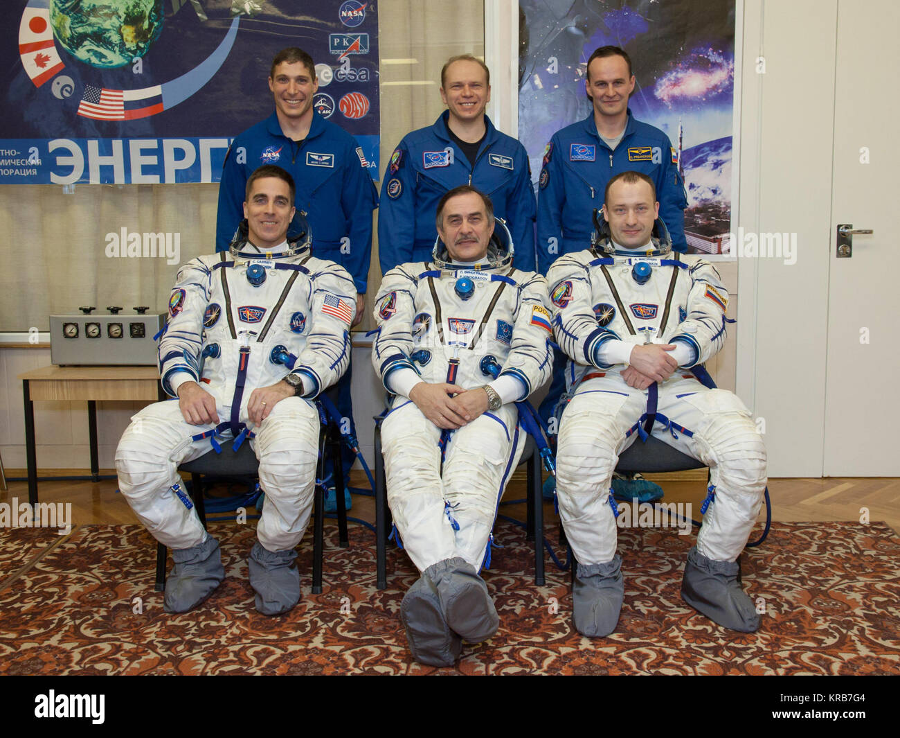 In the Integration Facility at the Baikonur Cosmodrome in Kazakhstan, the Expedition 35-36 prime and backup crews pose for pictures March 17 during a systems dress rehearsal called a “fit check”. Left to right in the front row is the prime crew ---  NASA Flight Engineer Chris Cassidy, Soyuz Commander Pavel Vinogradov and Flight Engineer Alexander Misurkin. Left to the right in the back row are backup crewmembers Michael Hopkins of NASA, Oleg Kotov and Sergey Ryazanskiy. Cassidy, Vinogradov and Misurkin are preparing for launch to the International Space Station from Baikonur on March 29, Kazak Stock Photo
