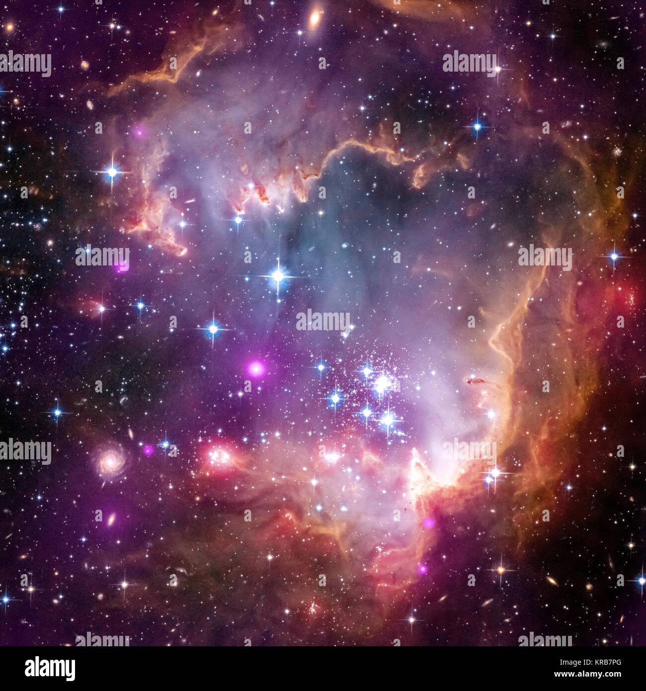 New Chandra observations have been used to make the first detection of X-ray emission from young stars with masses similar to our Sun outside our Milky Way galaxy. The Chandra observations of these low-mass stars were made of the region known as the "Wing" of the Small Magellanic Cloud (SMC), one of the Milky Way's closest galactic neighbors. In this composite image of the Wing the Chandra data is shown in purple, optical data from the Hubble Space Telescope is shown in red, green and blue and infrared data from the Spitzer Space Telescope is shown in red. Astronomers call all elements heavier Stock Photo