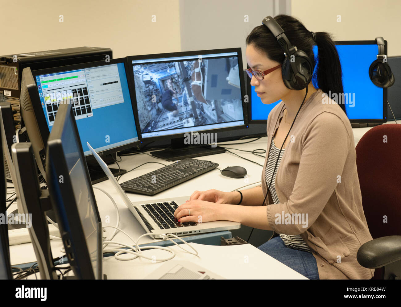 Estrellina Pacis on console as science lead in the Multi-Mission Operations Center Stock Photo