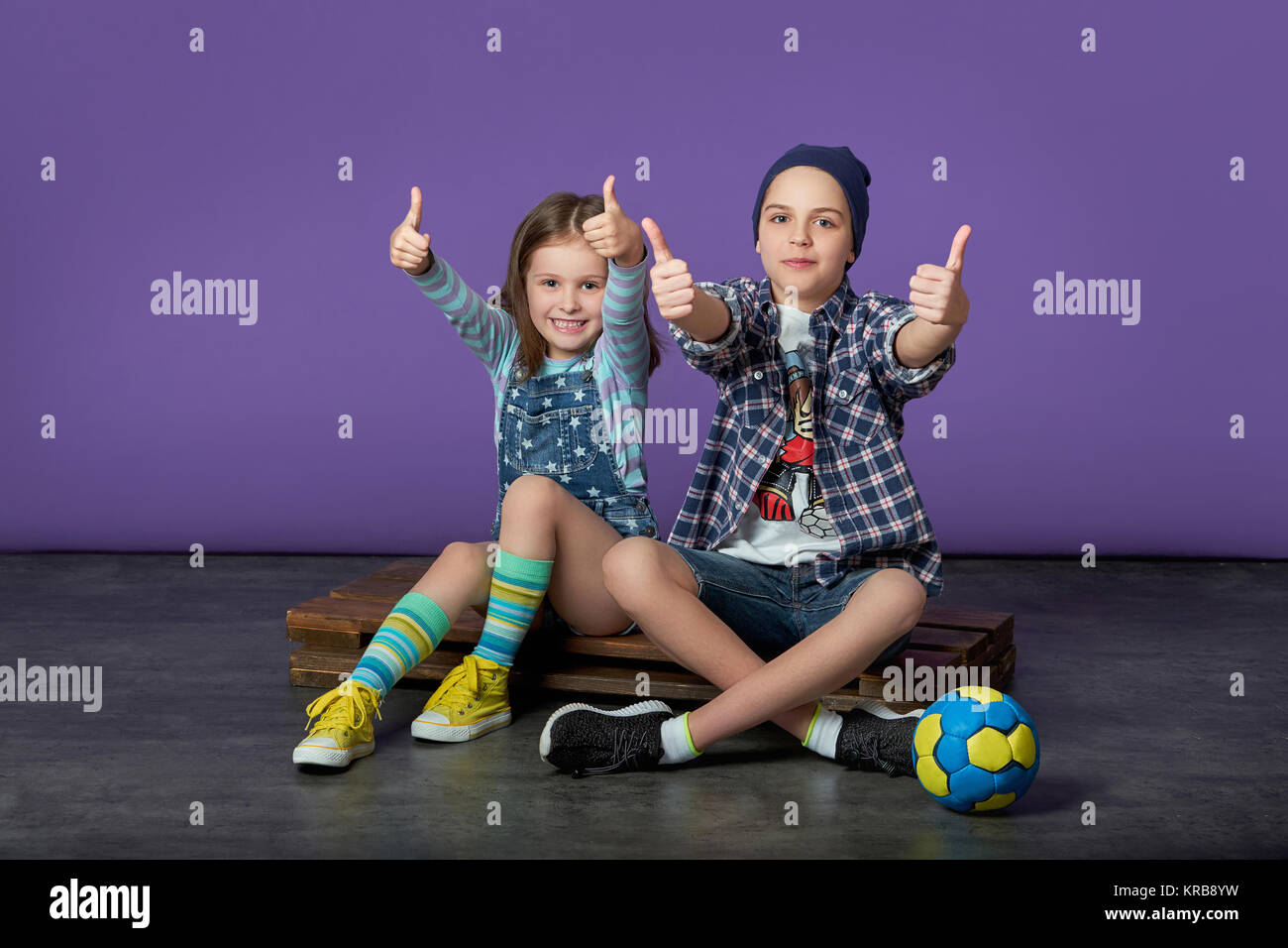 beautiful kids loves sports.friends of the children show a like thumbs